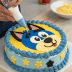 piping buttercream onto bluey cake