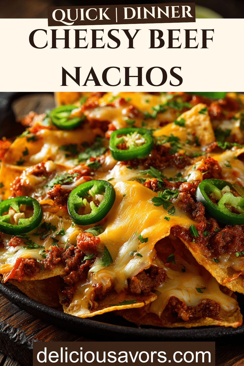 Cheesy Beef Nachos piled high on a platter with golden tortilla chips, melted cheese, ground beef, pickled jalapenos, and fresh cilantro—perfect for family dinner or parties.