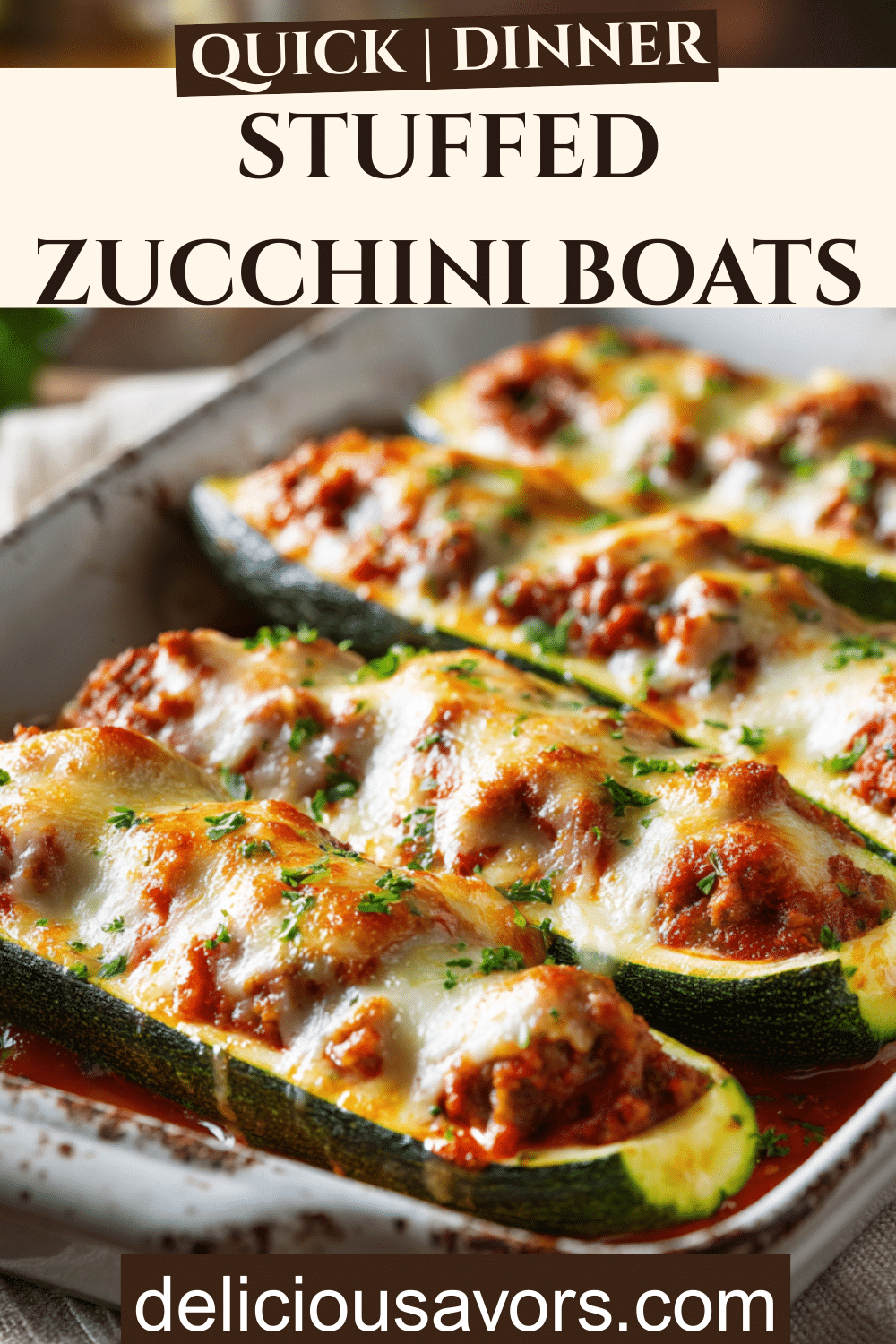 Stuffed zucchini boats filled with Italian sausage, marinara sauce, and melted mozzarella cheese in a white baking dish, garnished with fresh parsley.