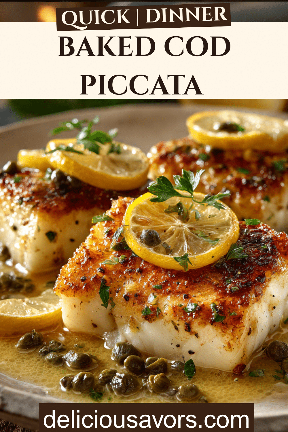 Golden pan-seared cod piccata with lemon slices, capers, and butter sauce on white plate