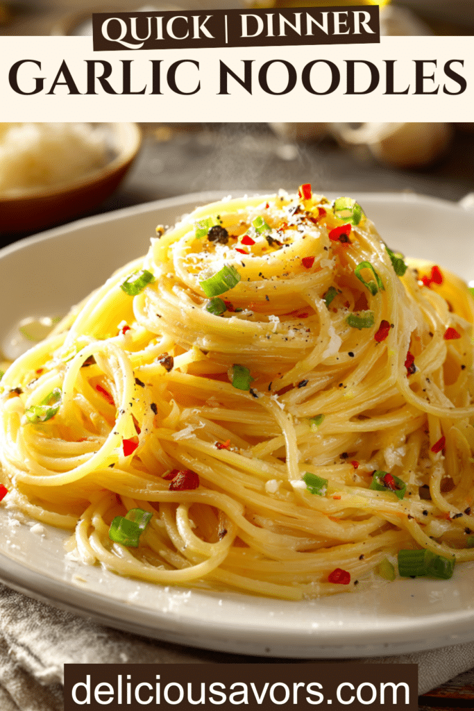 Buttery garlic noodles with green onions and red pepper flakes on white plate, easy 15-minute weeknight dinner recipe