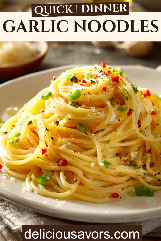 Buttery garlic noodles with green onions and red pepper flakes on white plate, easy 15-minute weeknight dinner recipe