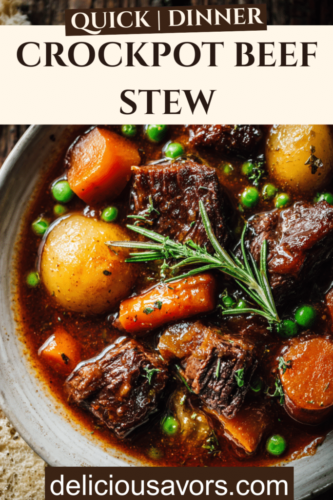 Overhead view of hearty crockpot beef stew with tender meat chunks, carrots, potatoes, and peas in rich brown gravy, served in white bowl with crusty bread