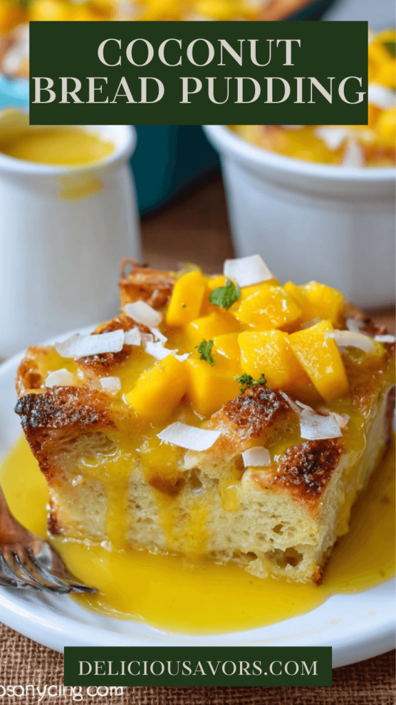 Slice of creamy coconut bread pudding with golden mango sauce and shredded coconut on white plate