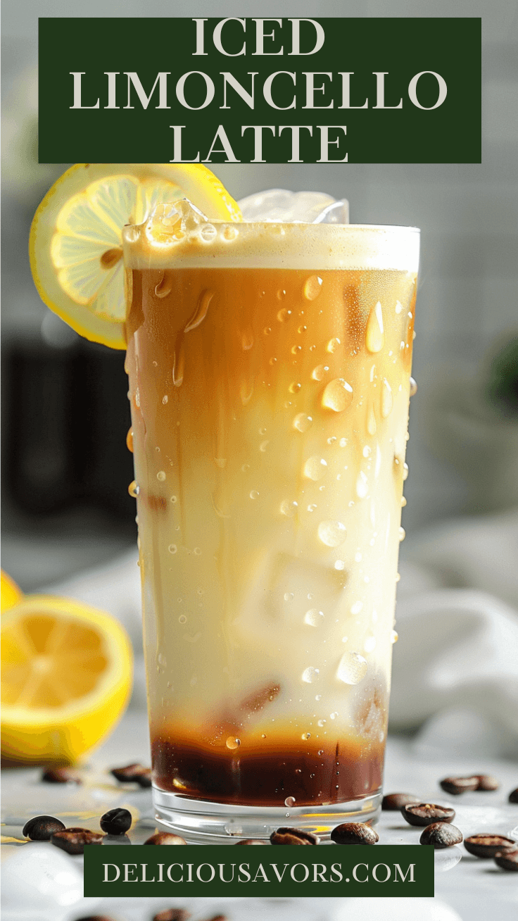 Iced Limoncello Latte in a tall glass with ice and lemon twist garnish on marble countertop with coffee beans