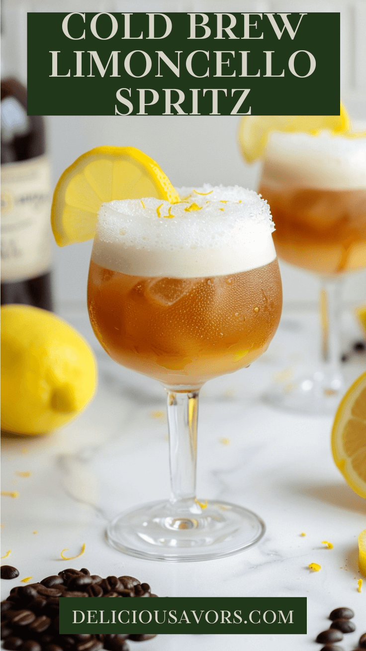 Cold Brew Limoncello Spritz cocktail in elegant glass with foam top and fresh lemon garnish on white marble surface surrounded by lemons and coffee beans