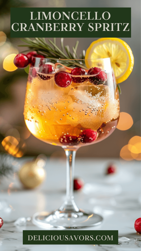 Limoncello cranberry holiday spritz cocktail in wine glass with fresh lemon wheel, cranberries, and rosemary garnish on marble countertop