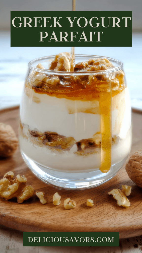 Greek yogurt layered with golden honey and chopped walnuts in a clear glass jar on wooden table, healthy Mediterranean breakfast bowl